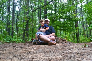 Benjamin and I sit next to the cairn that marks the summit of Driskill Mountain